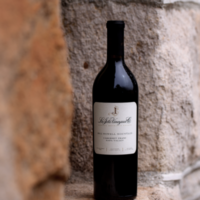 La Jota Cabernet Franc Bottle Shot on a stone wall